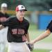 Milan High School pitcher sophomore Thomas Lindeman races to celebrate with teammate, junior Bryan Wagner after Milan beat Coldwater High School in the MHSAA baseball quarterfinals at Nichols Field at Bailey Park in Battle Creek on Tuesday, June 11, 2013. Melanie Maxwell | AnnArbor.com